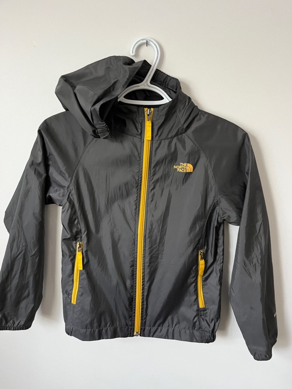 The North Face Kids Grey Raincoat with Yellow Zippers